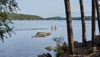 Two people paddling a canoe in the swedish archipelago in Göteborg, Sweden